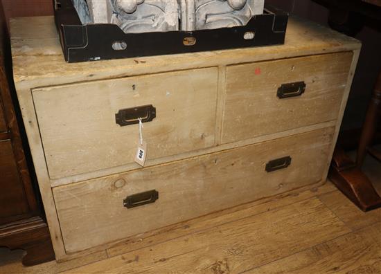 A base section of a military style pine chest, fitted two short and one long drawers W.96cm